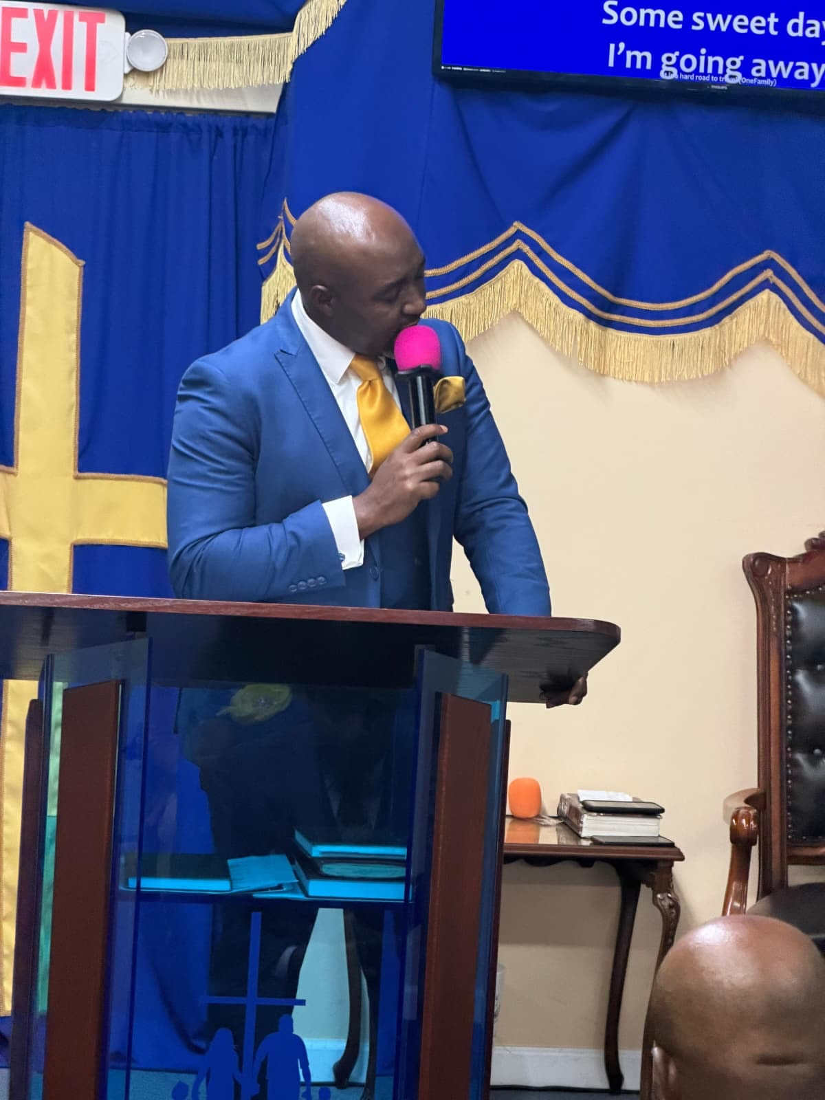 Pastor preaching at the pulpit during Sunday service