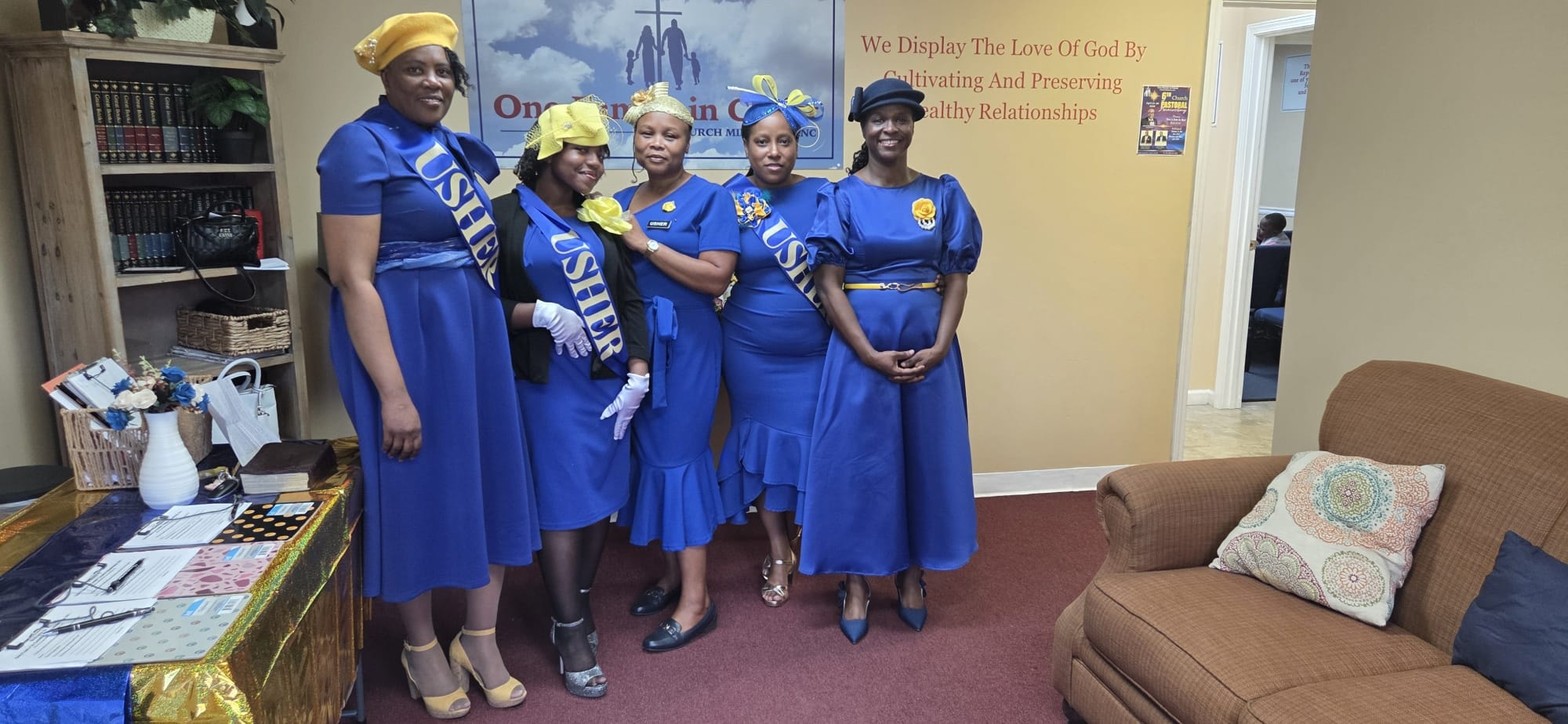 Ushers in blue uniforms at One Family in Christ Church